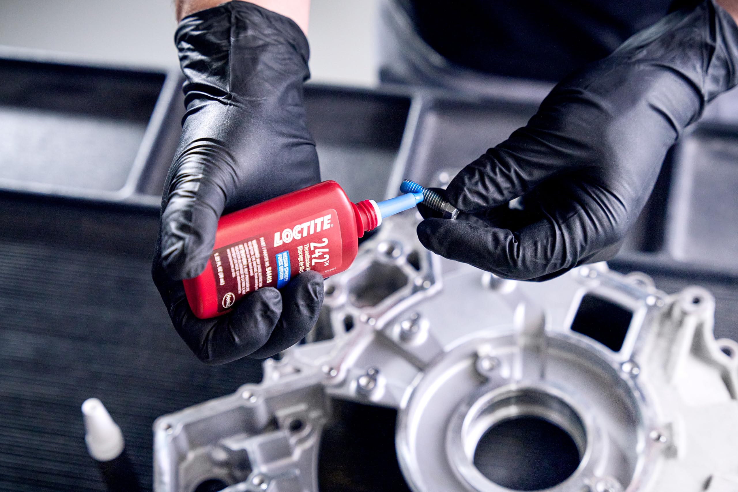 Cured Loctite 242 on engine bolts showing secure hold