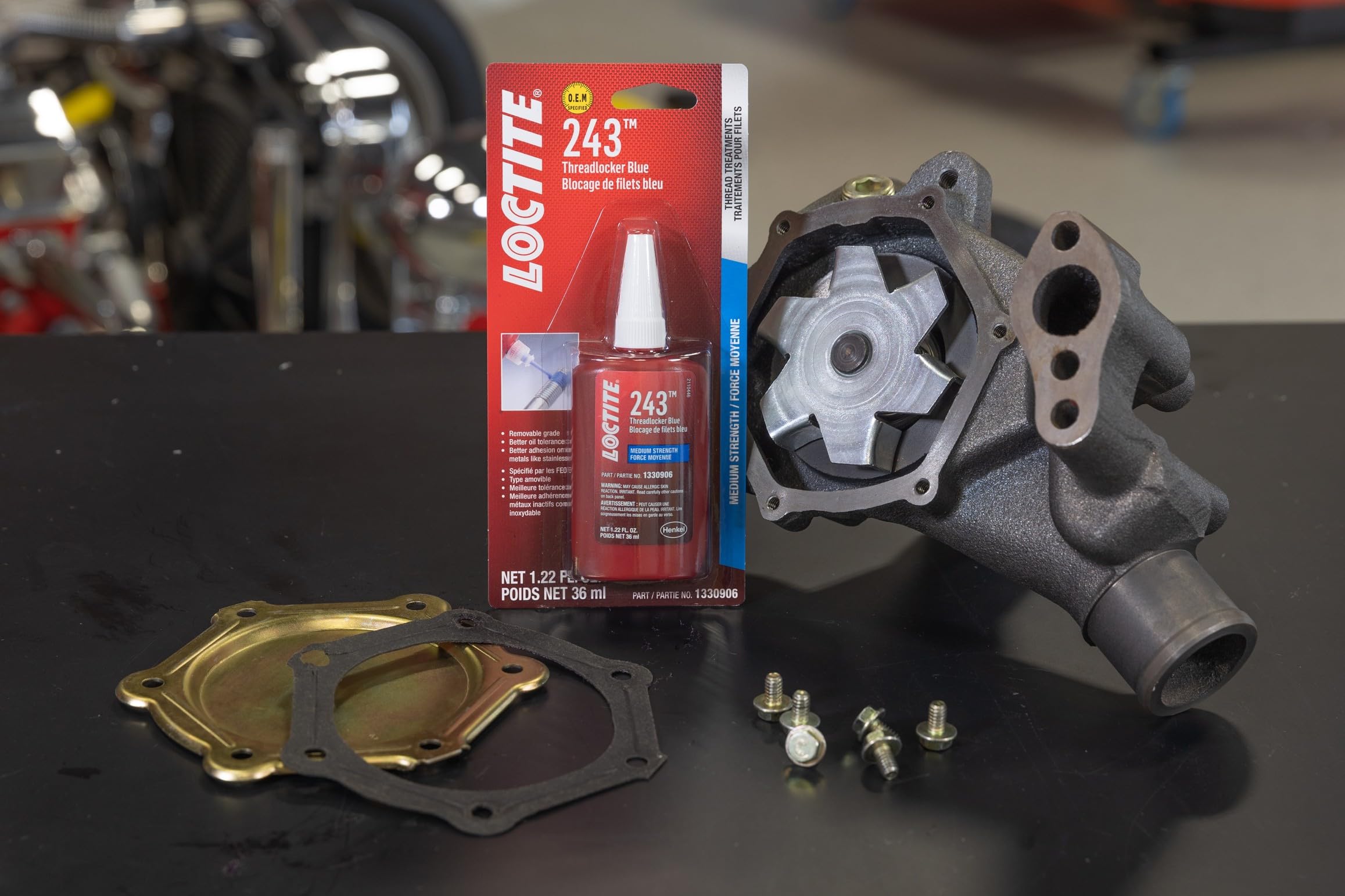 Loctite 243 on bolt threads demonstrates oil-tolerant bonding in engines.