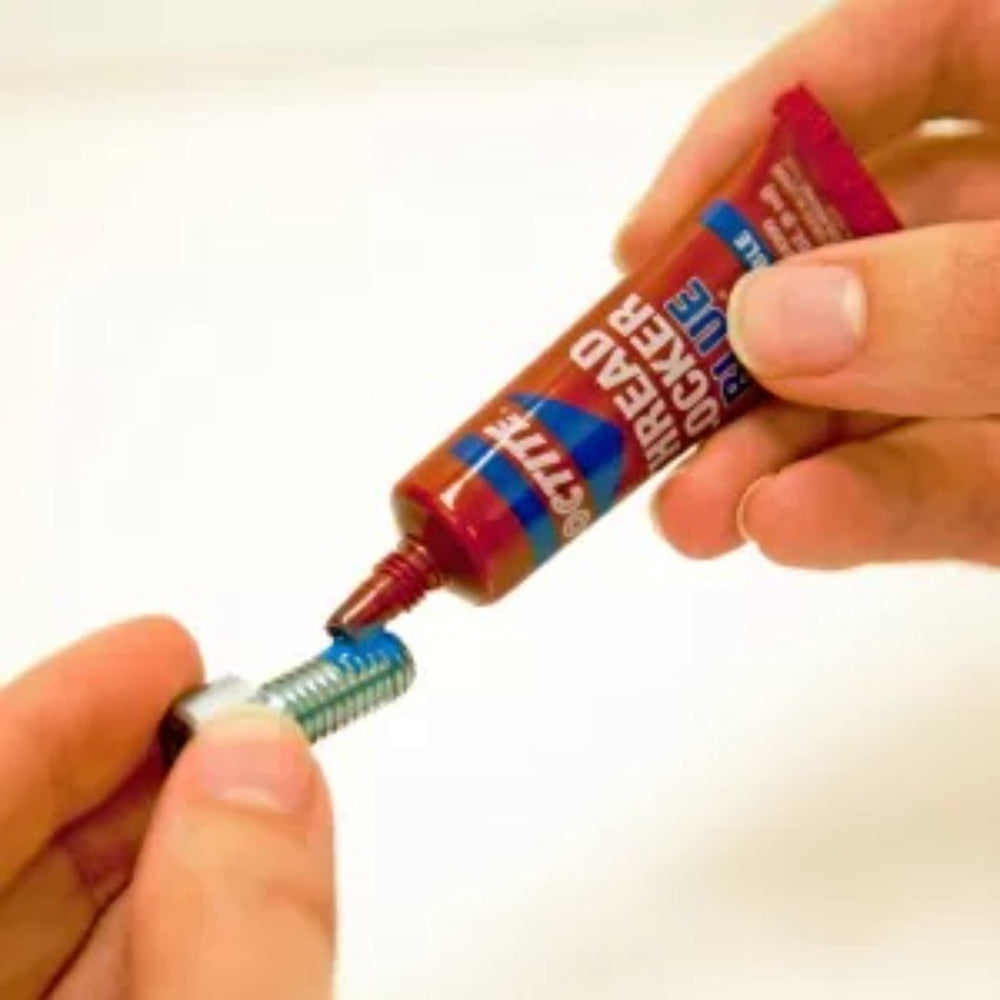 Fully cured Loctite Blue 242 bond on metal threads indicating strong hold.