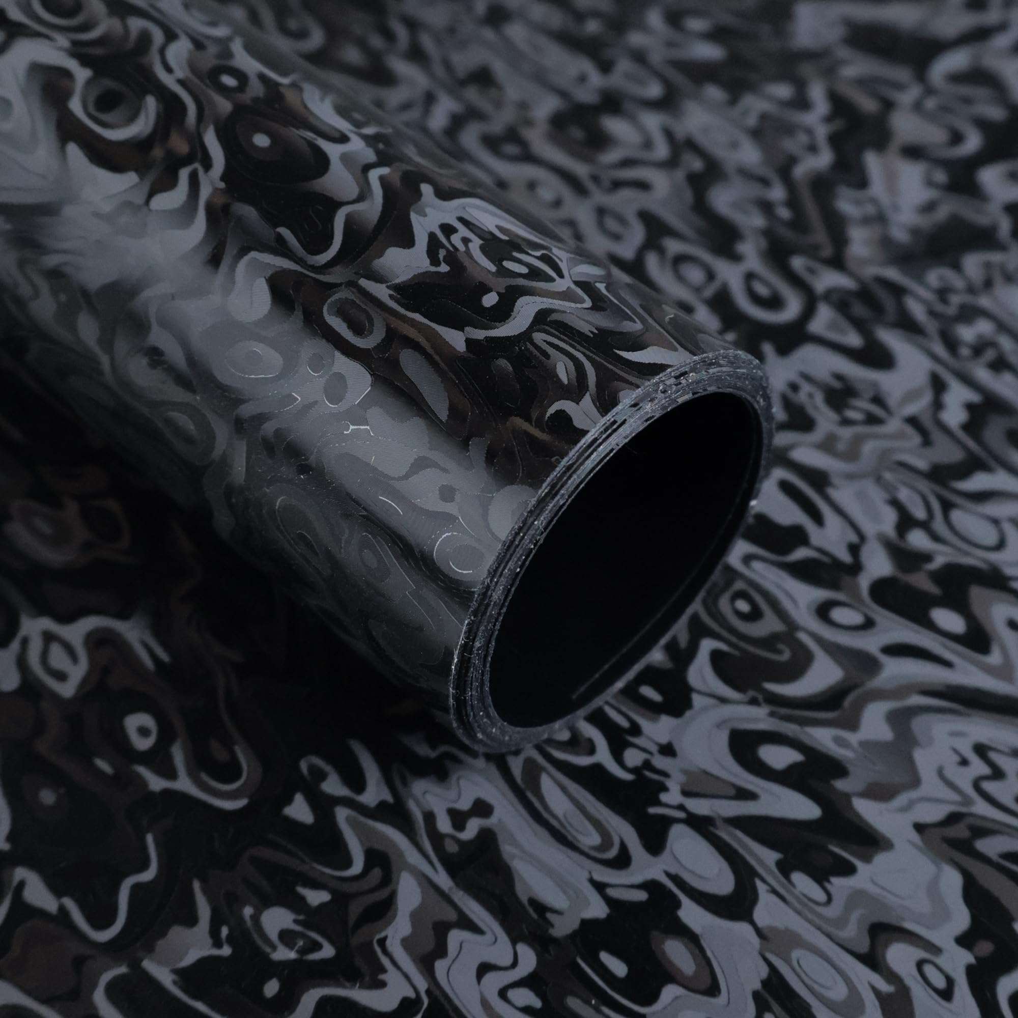Lypumso forged carbon wrap with cosmic ghost texture on a car exterior for a premium look.