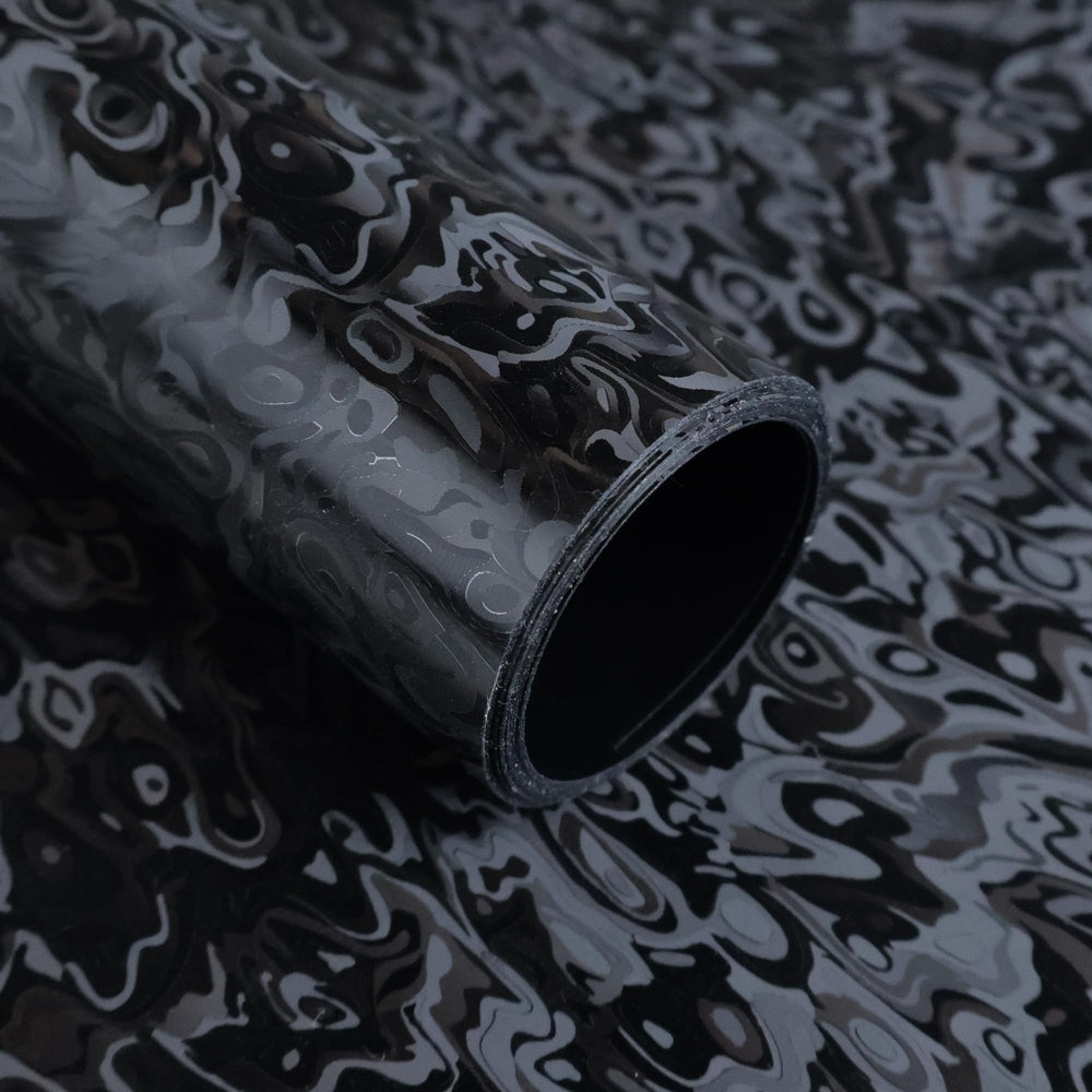 Lypumso forged carbon wrap with cosmic ghost texture on a car exterior for a premium look.