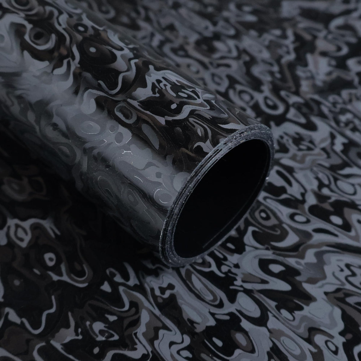 Lypumso forged carbon wrap with cosmic ghost texture on a car exterior for a premium look.