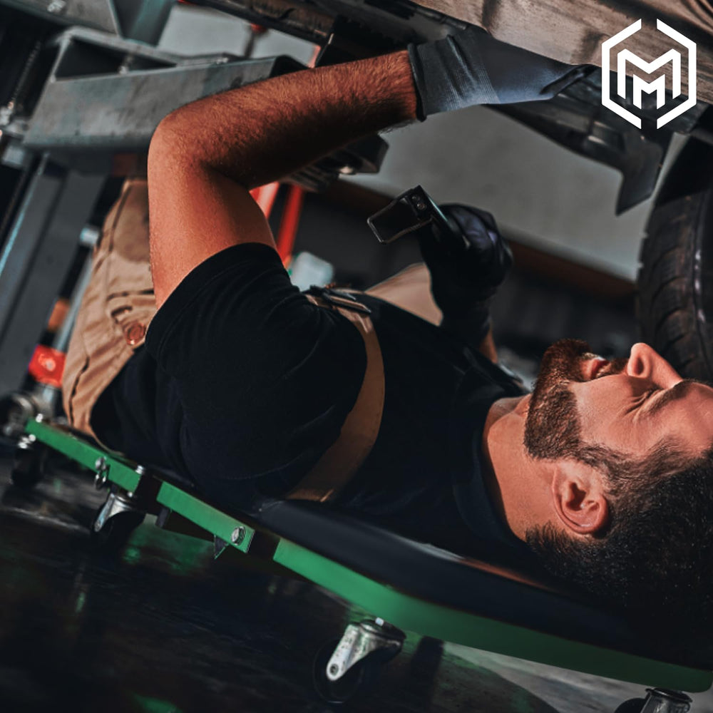 M-AUTO creeper bed with thick padding for comfort during repairs.