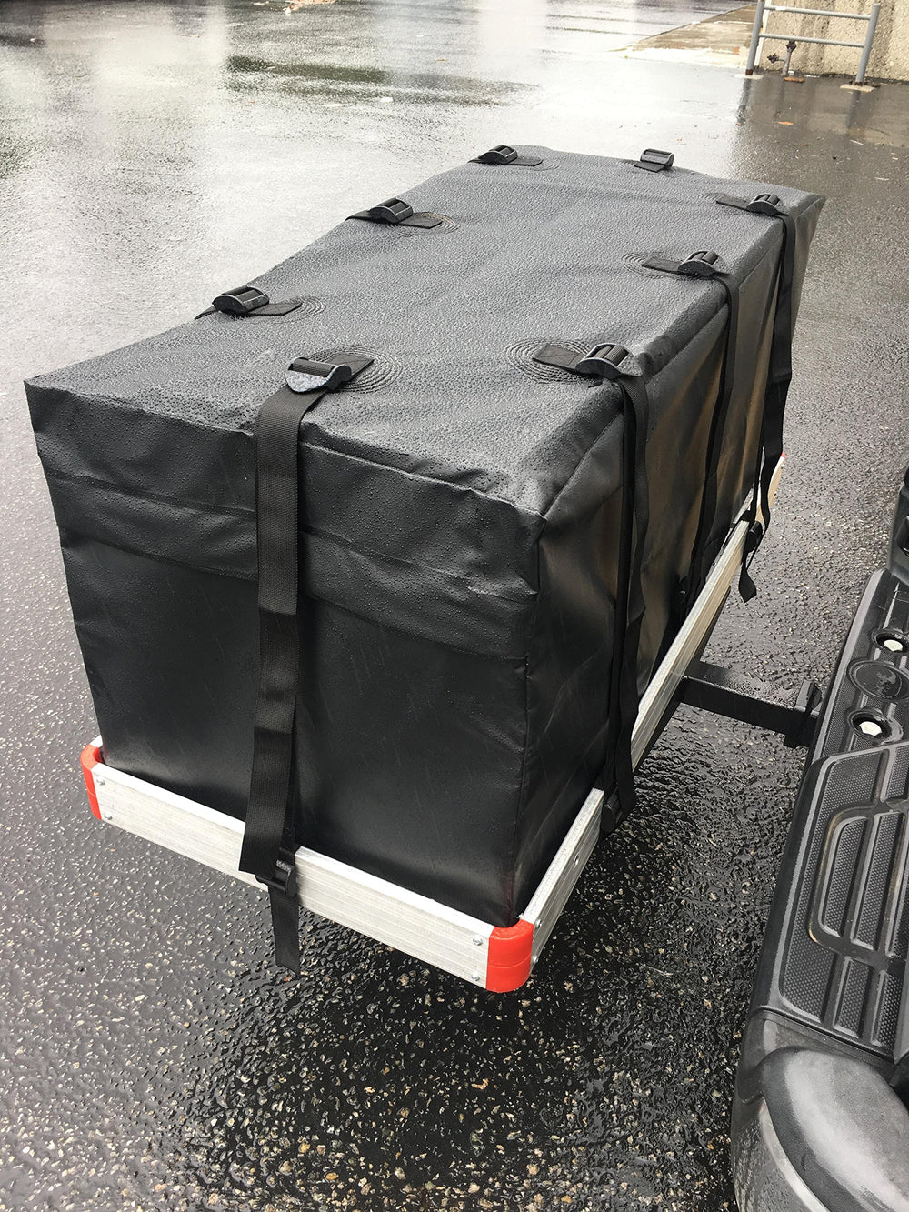 MAXXHAUL cargo bag attached to hitch rack demonstrating secure add-on storage.