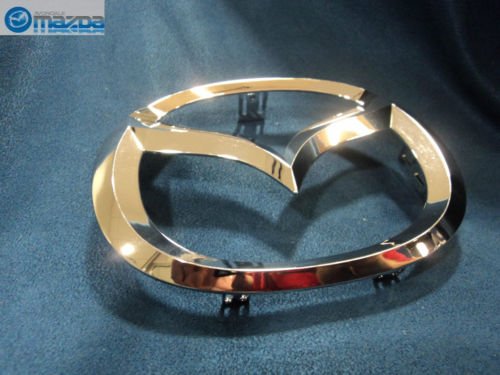 OEM emblem part for Mazda2-3-5-6, seamless integration with factory styling.