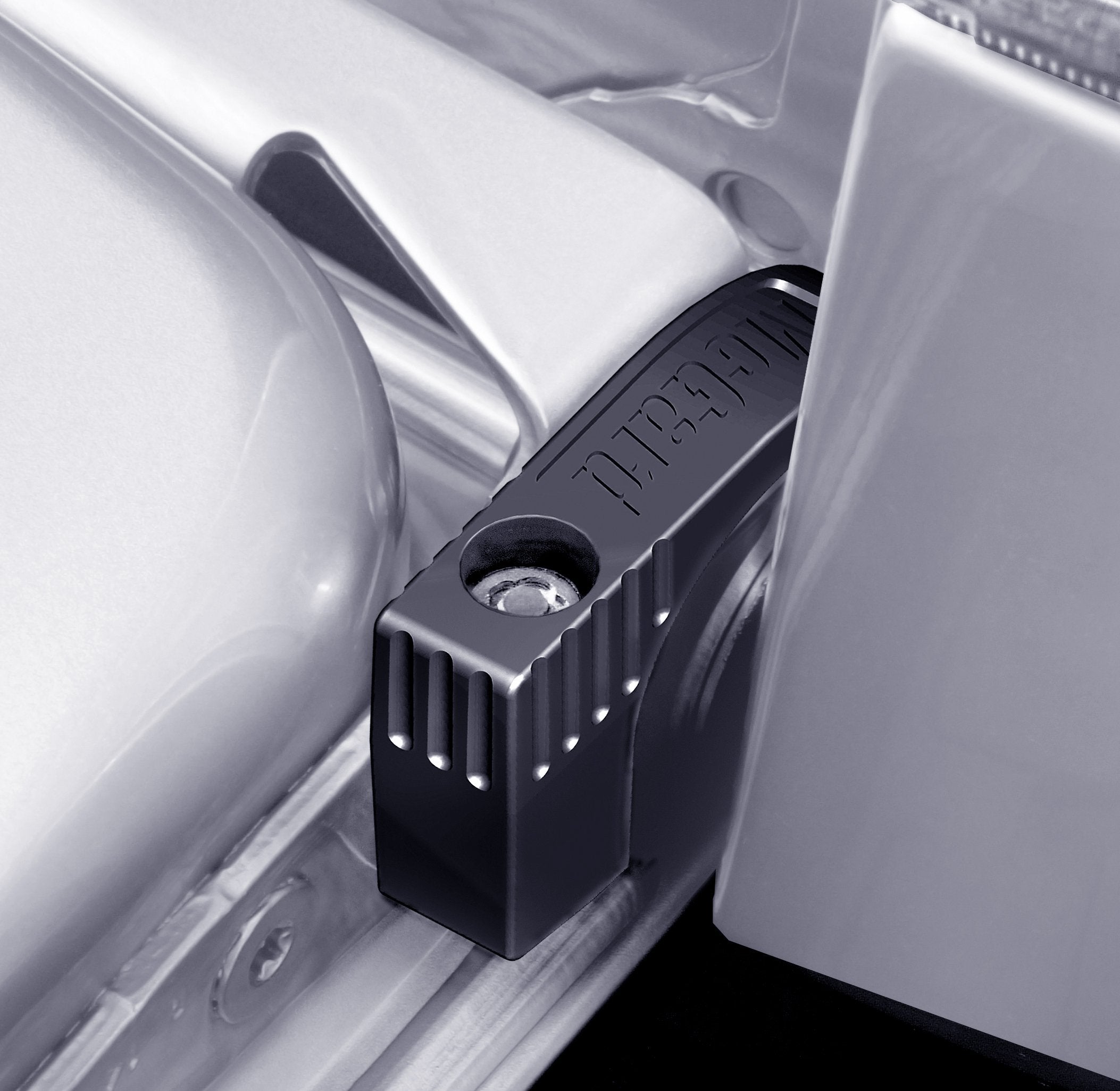 McGard 76029 tailgate lock installed on vehicle for theft protection.