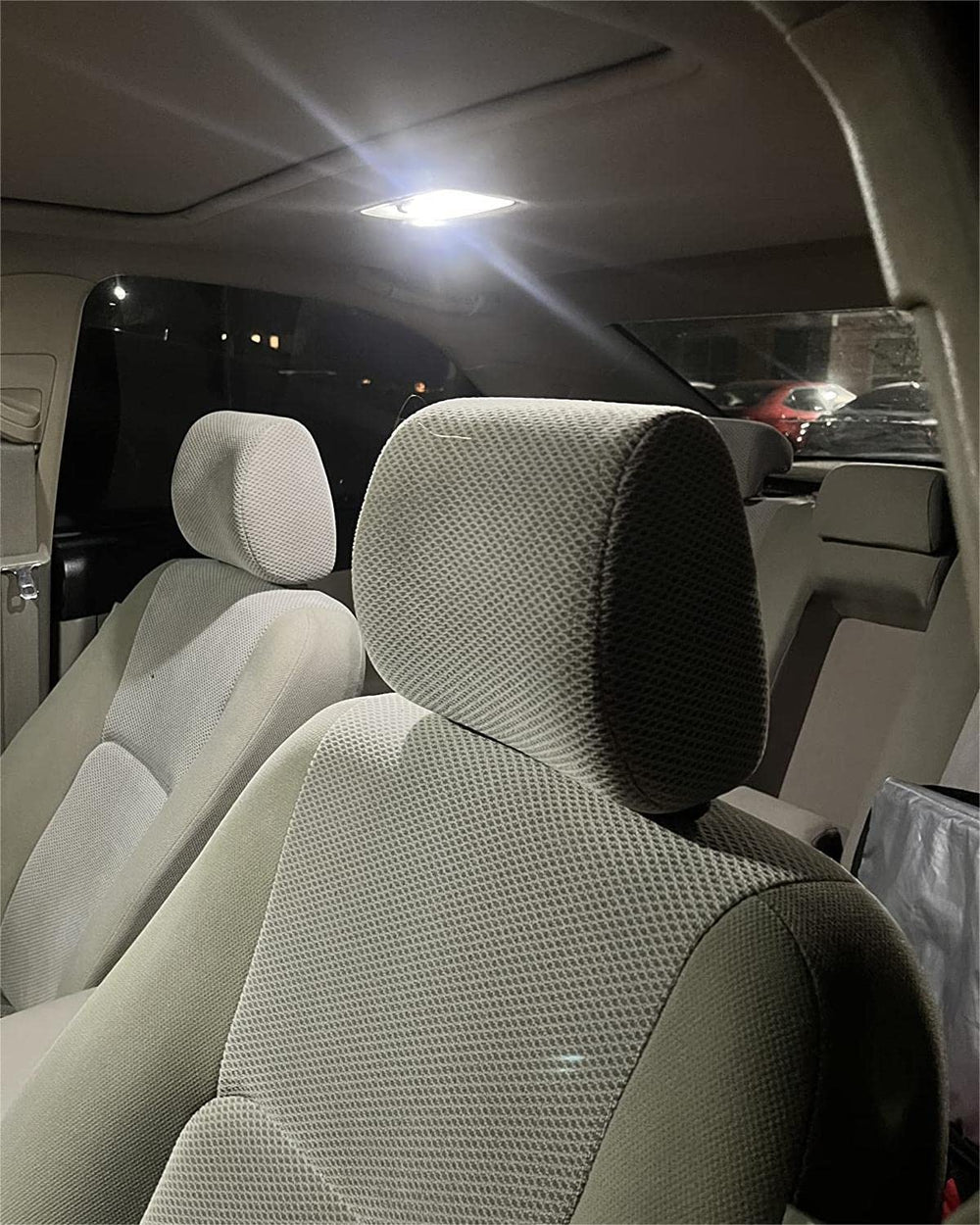 MEALAM trunk cargo light reveals luggage area at dusk