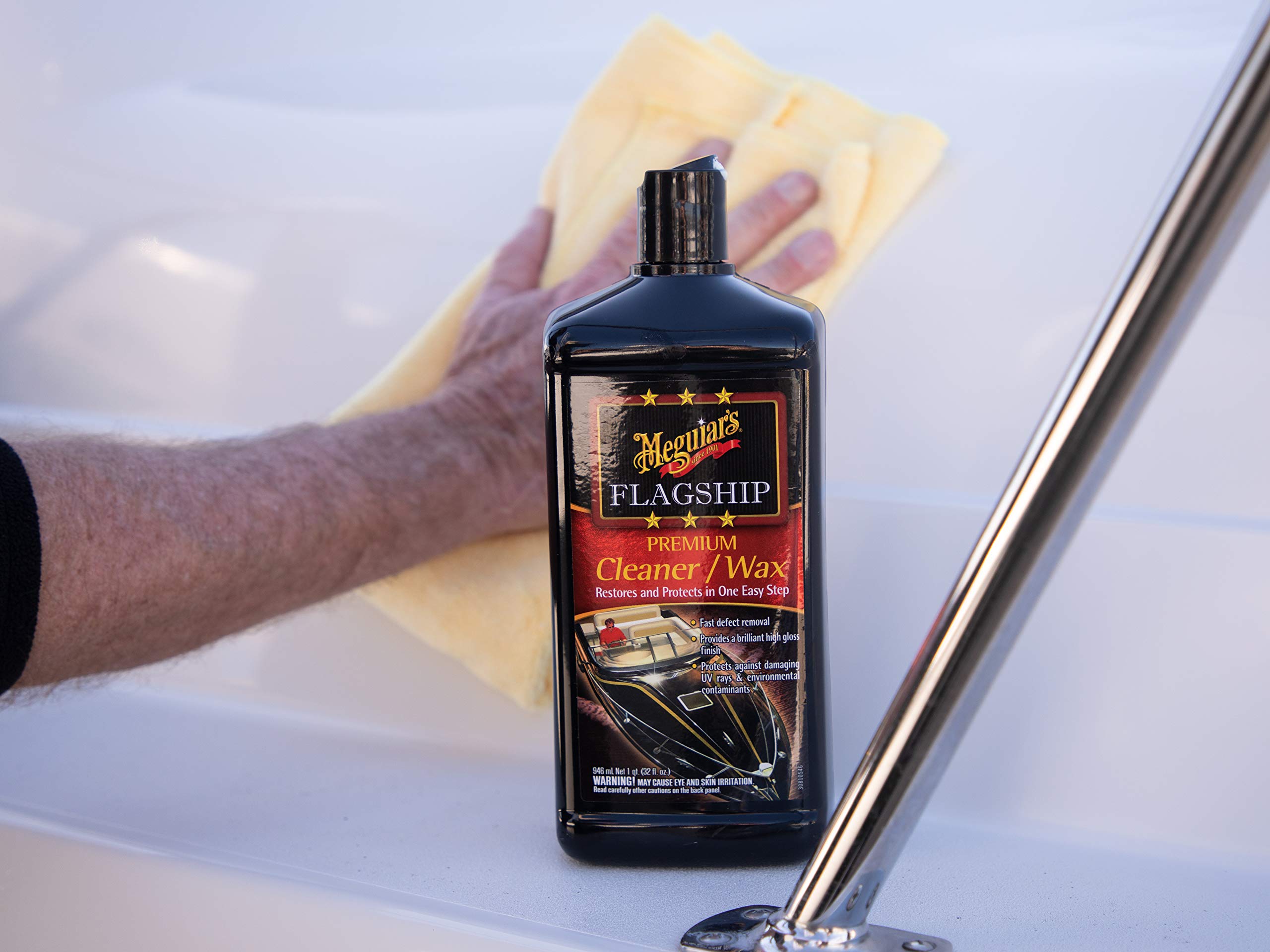 Professional detailer applying Meguiar's Flagship to remove light defects and boost shine