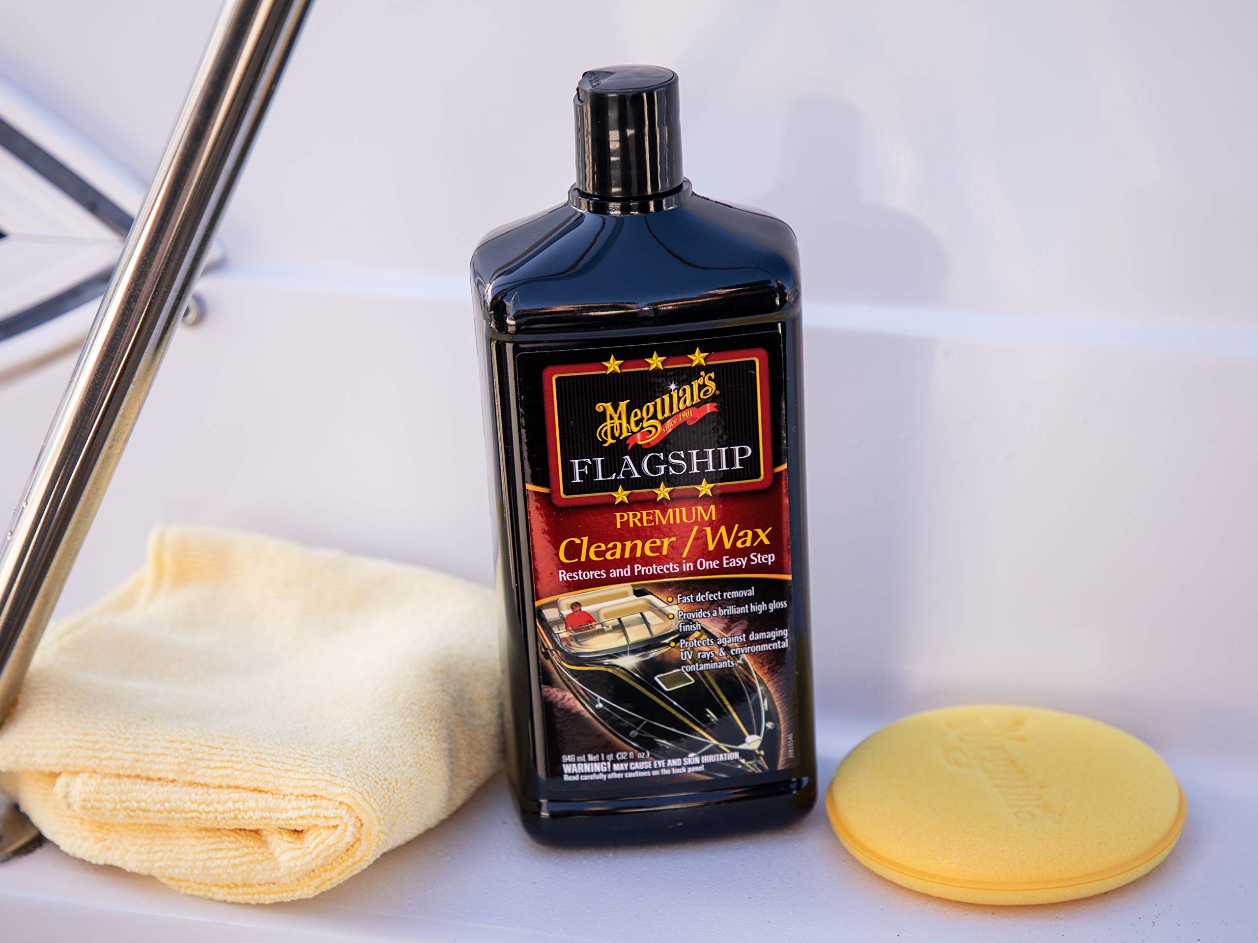 Meguiar's Flagship wax being hand-applied on a boat for UV protection