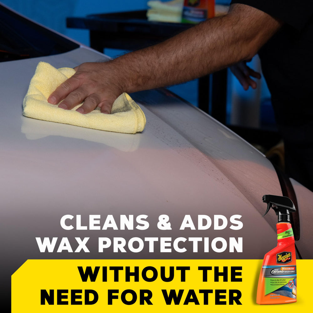 Meguiar's spray being wiped with premium microfiber towel for quick detailing