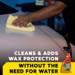 Meguiar's spray being wiped with premium microfiber towel for quick detailing