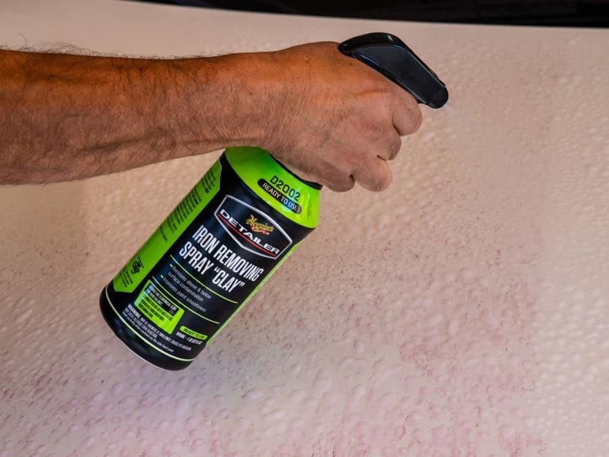 Meguiar's Iron Removing Spray Clay being applied as a mist for iron removal.