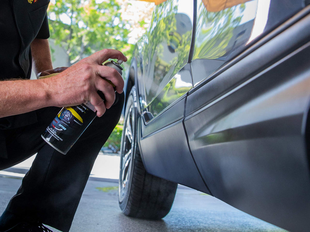 Meguiar's Ultimate Black spray action on trim ensures quick, even coverage.