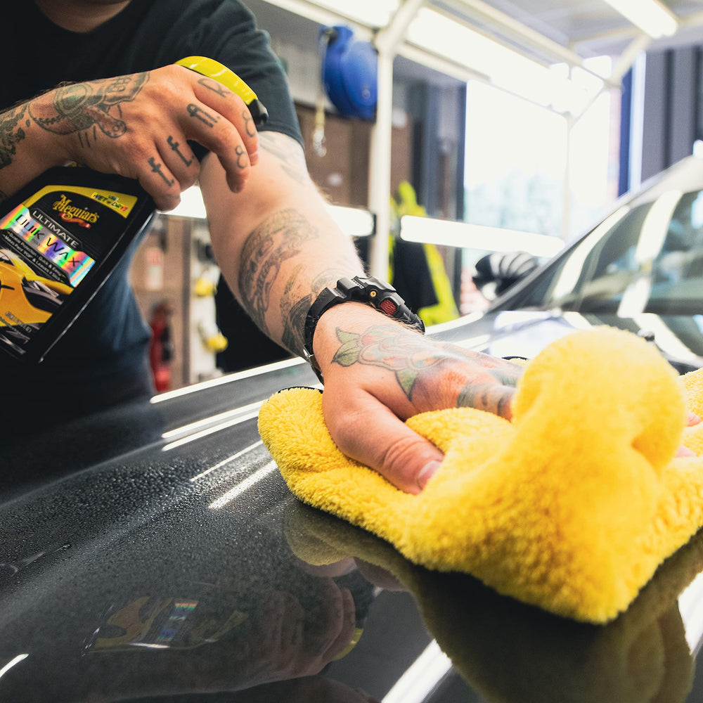 Meguiar's Ultimate Quik Spray Wax applied under sun with easy wipe-off.