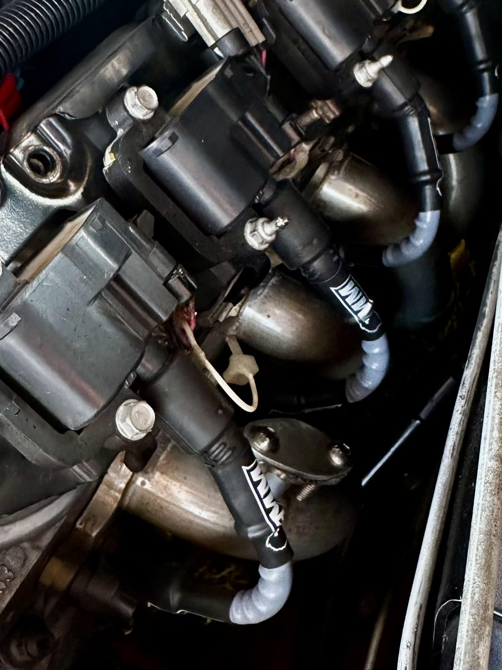 Michigan Motorsports black 10mm wires on a Silverado-style truck for aftermarket styling.