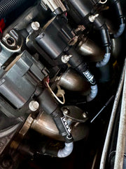 Michigan Motorsports black 10mm wires on a Silverado-style truck for aftermarket styling.
