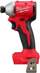 Milwaukee M18TRADE compact brushless 14-hex impact driver in action for tight spaces.