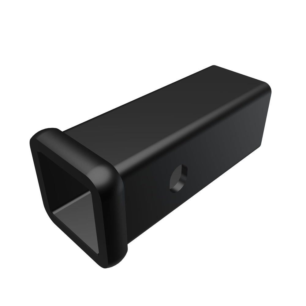 Mopar hitch adapter close-up showing 2.5in to 2in conversion for 2013–2016 Ram 2500/3500.