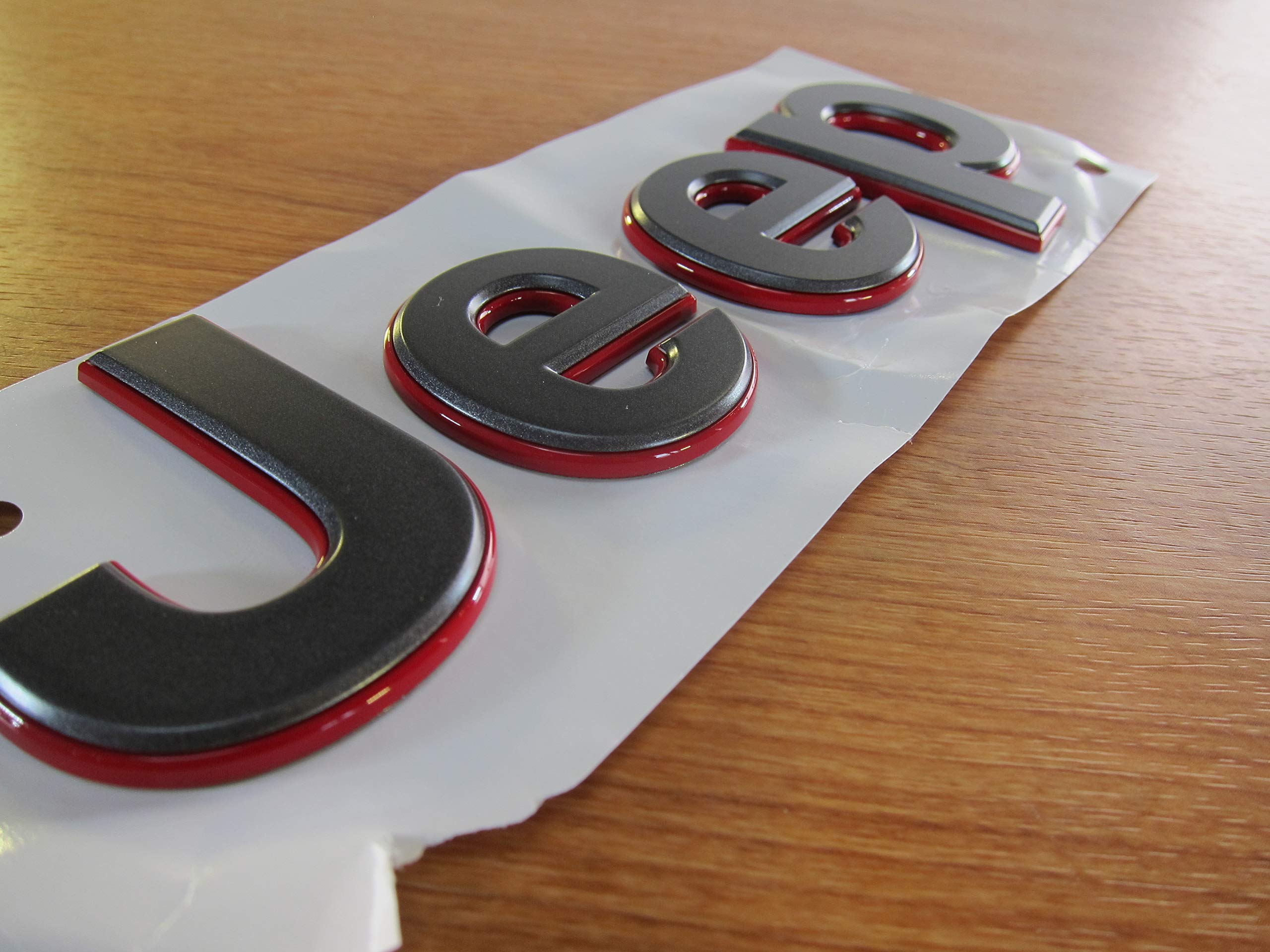 New Mopar badge packaging ready for replacement on Wrangler JL