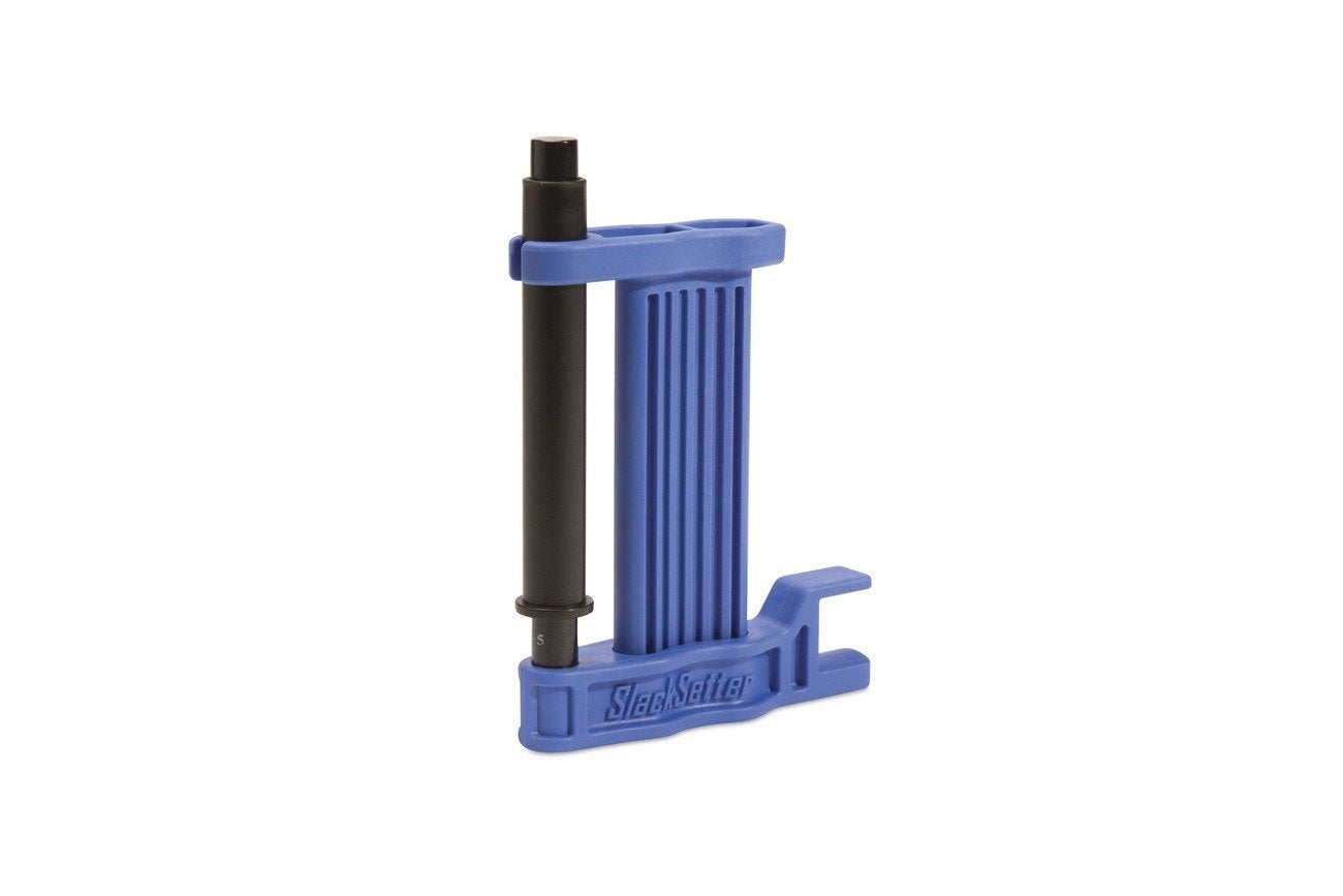 Motion Pro Slack Setter Chain Tool in use, compact kit-ready for roadside maintenance.