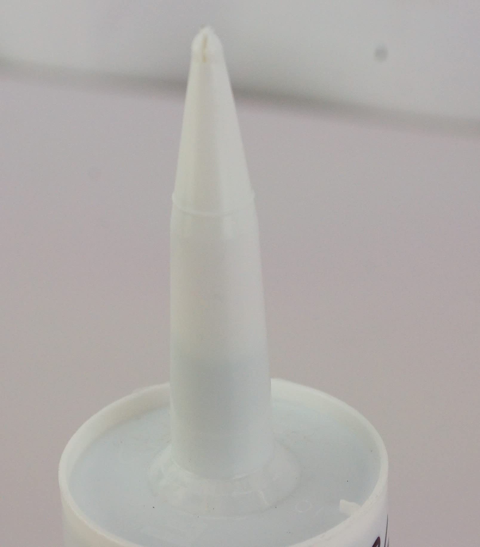 Motorcraft RTV sealant application tip demonstrates clean, precise dispensing.