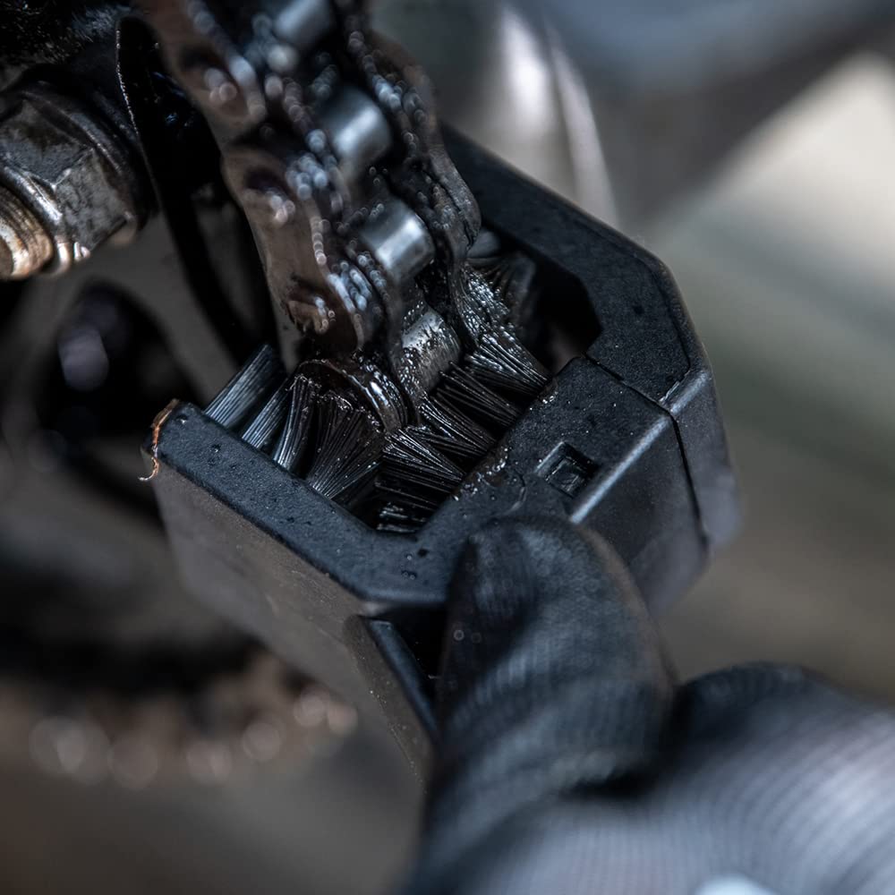 Muc-Off Motorcycle Chain Brush long end reaches front sprocket for deep grime agitation.