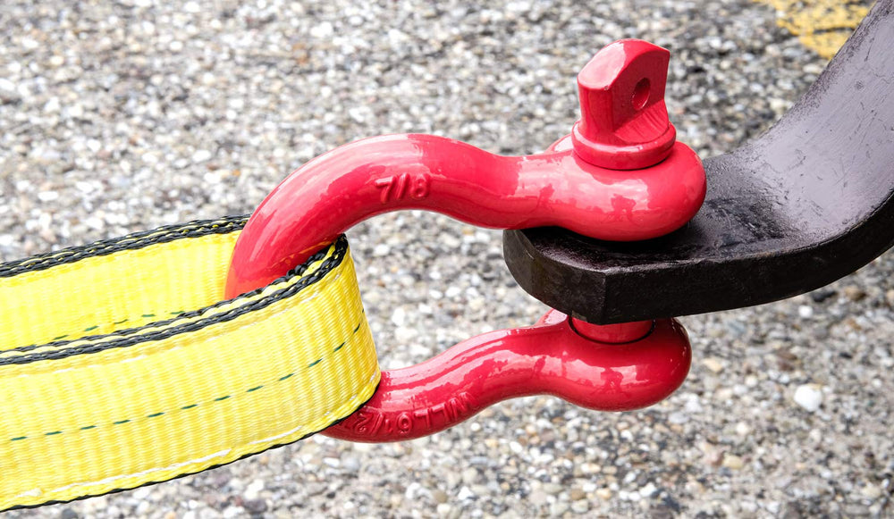 Anchor shackle design simplifies attachment to straps, chains, or winch lines.