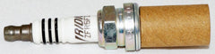 NGK 2477 iridium spark plug electrode edge closeup for reliable ignition.