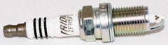 NGK 2477 iridium spark plug threads detail highlighting precision engineering.
