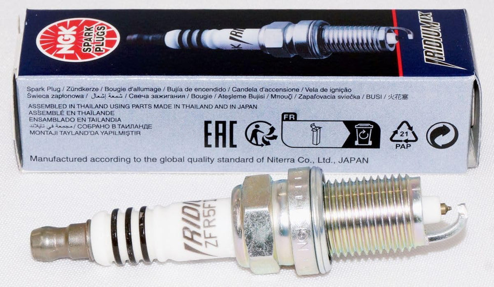 NGK 2477 spark plug four-pack packaging displayed for OEM compatibility.
