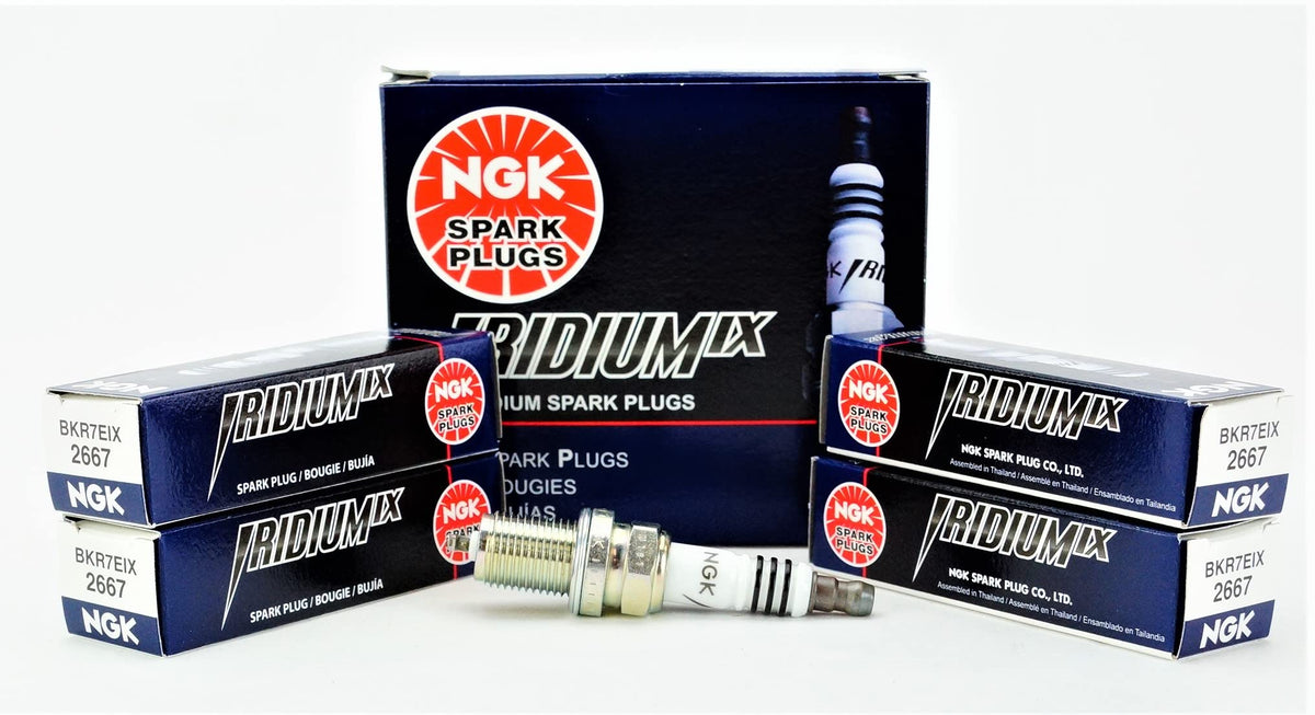 NGK Iridium IX spark plug close-up showing precise 0.6 mm electrode for faster starts