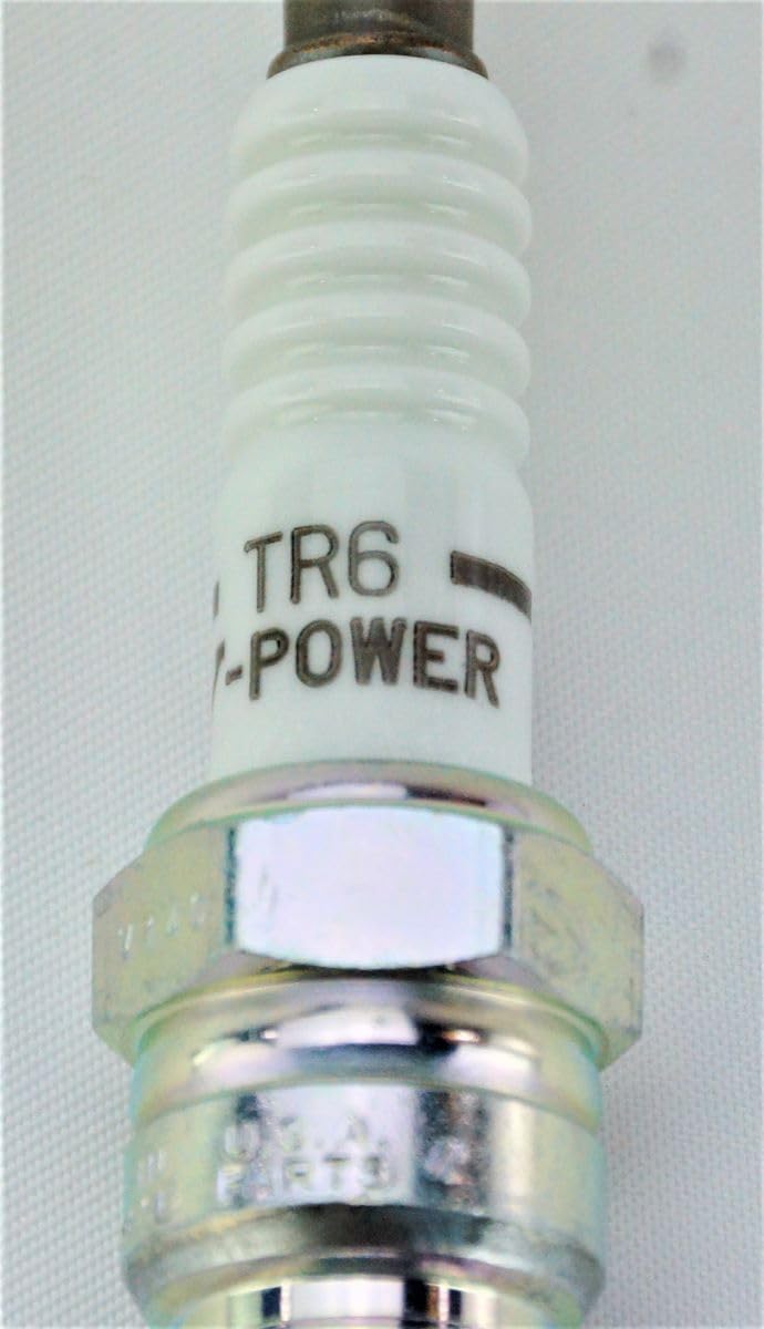 NGK 4177 TR6 V-Power spark plug shown on engine surface