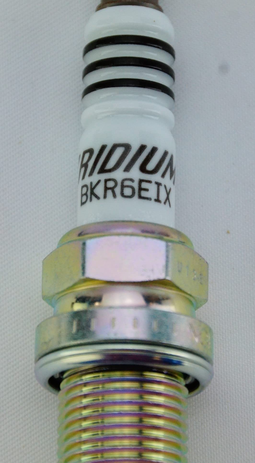 NGK 6418 spark plug four-pack packaging, convenient for routine maintenance.
