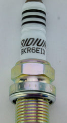 NGK 6418 spark plug four-pack packaging, convenient for routine maintenance.