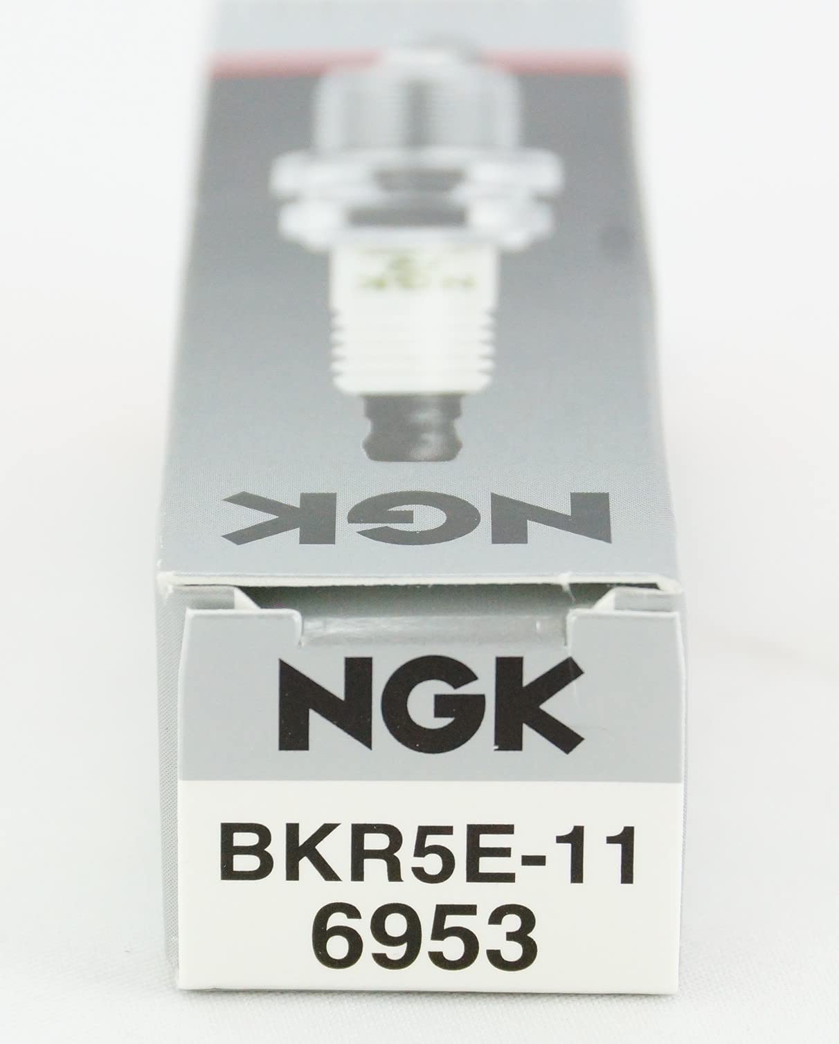 NGK 6953 spark plug BKR5E-11 durable ceramic design, long-lasting reliability.