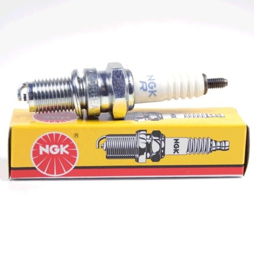 NGK 7162 spark plug in engine bay, designed for reliable performance.