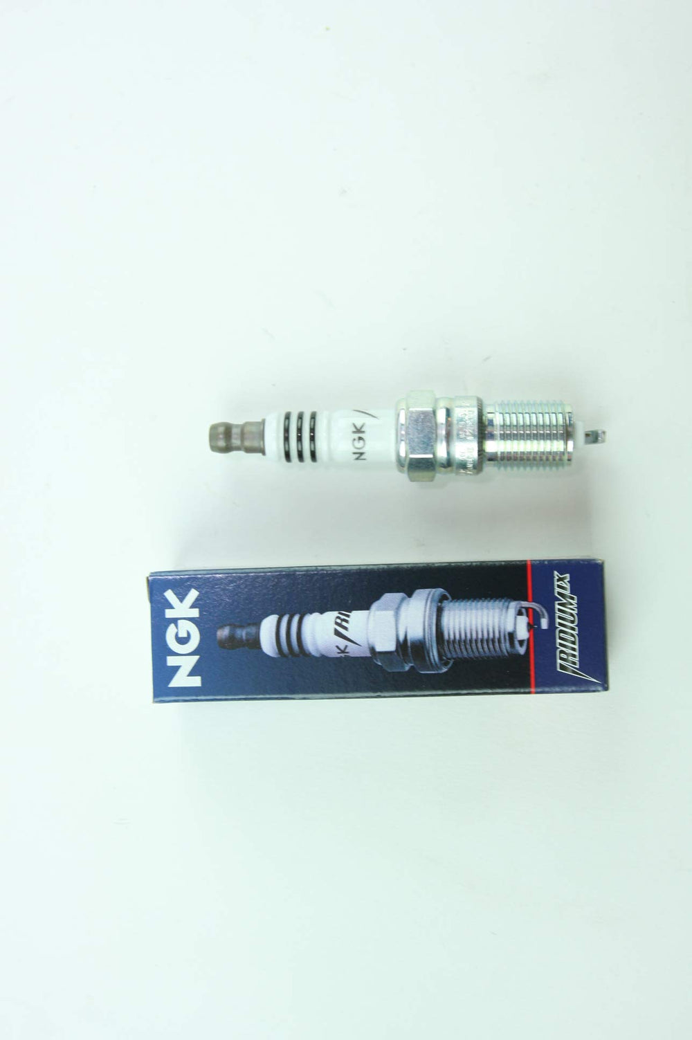 Close-up of Iridium IX spark plug tip highlighting durability