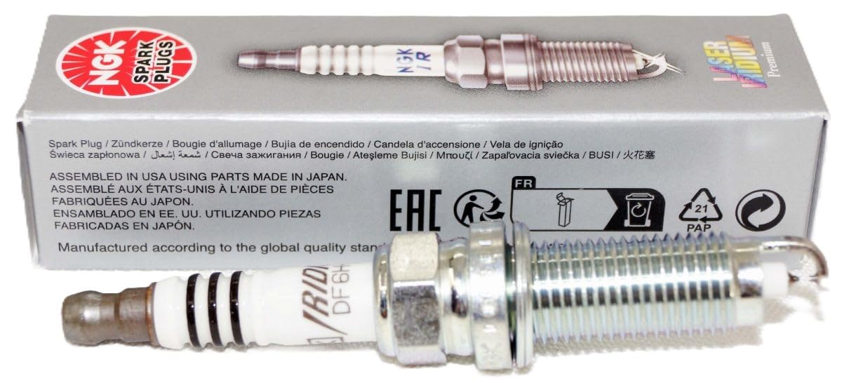 Close-up of NGK 94702 DF6H-11A spark plug with precision tip.