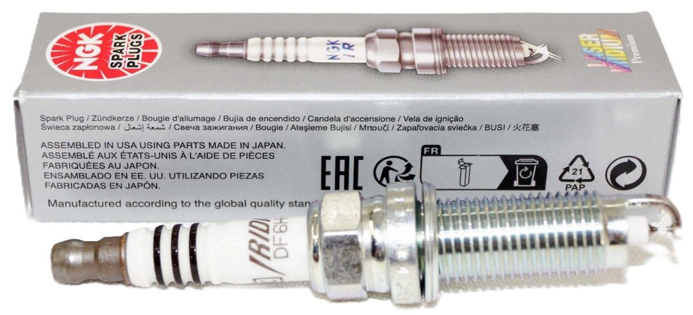 Close-up of NGK 94702 DF6H-11A spark plug with precision tip.