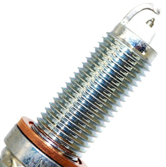 NGK 97506 spark plug in engine bay shows precise fitment.