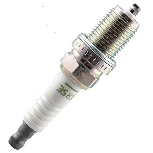 NGK BKR5E spark plug installed in engine during diagnostics
