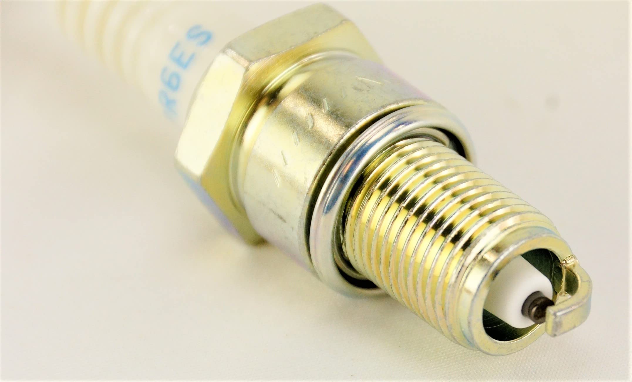 NGK BPR6ES triple-gasket seal close-up reduces leakage risk