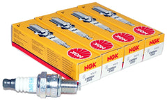 NGK CMR6H spark plug pack in yellow box indicating four-unit reliability