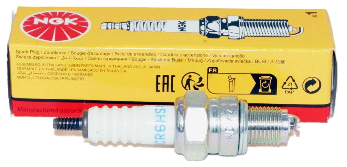 NGK CR6HSA spark plug close-up highlighting ceramic insulator and electrode.
