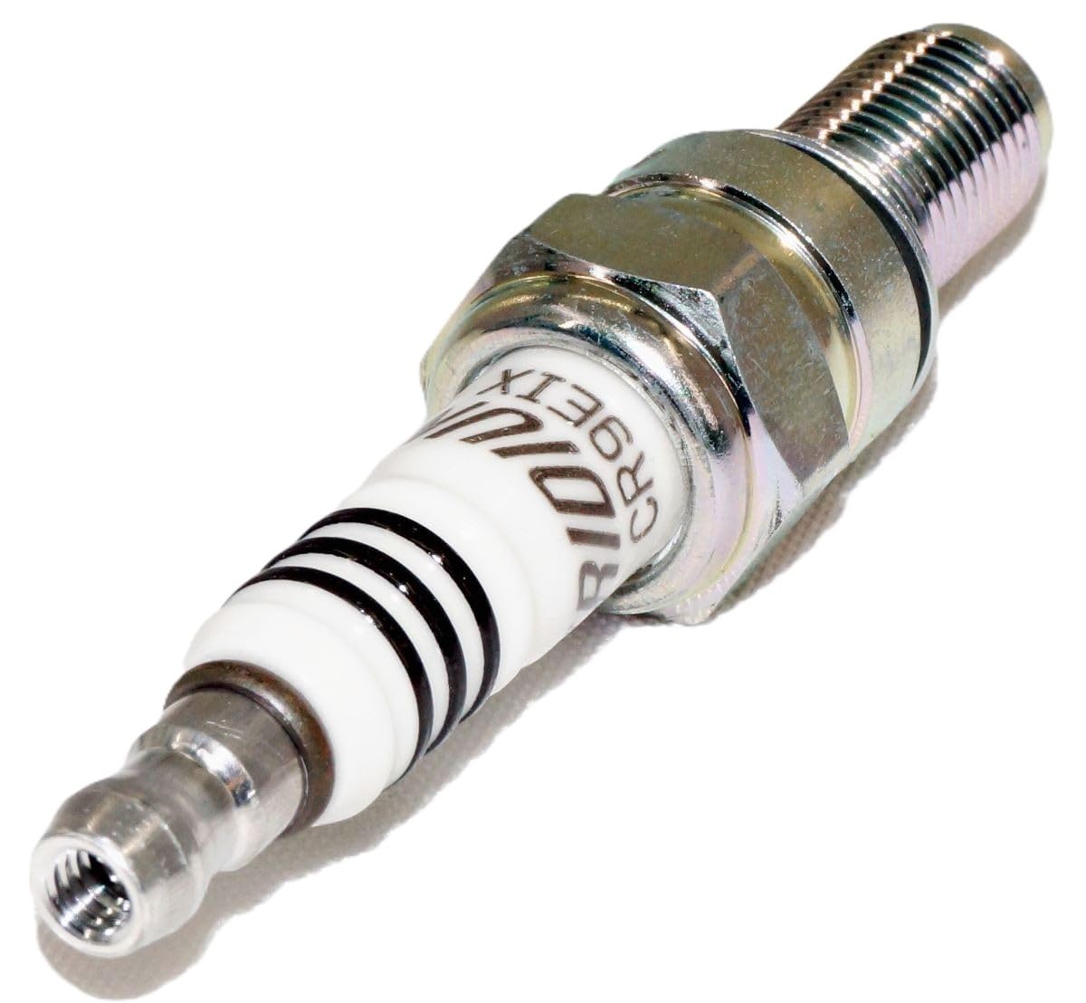 NGK Iridium IX spark plug on production line indicating quality control