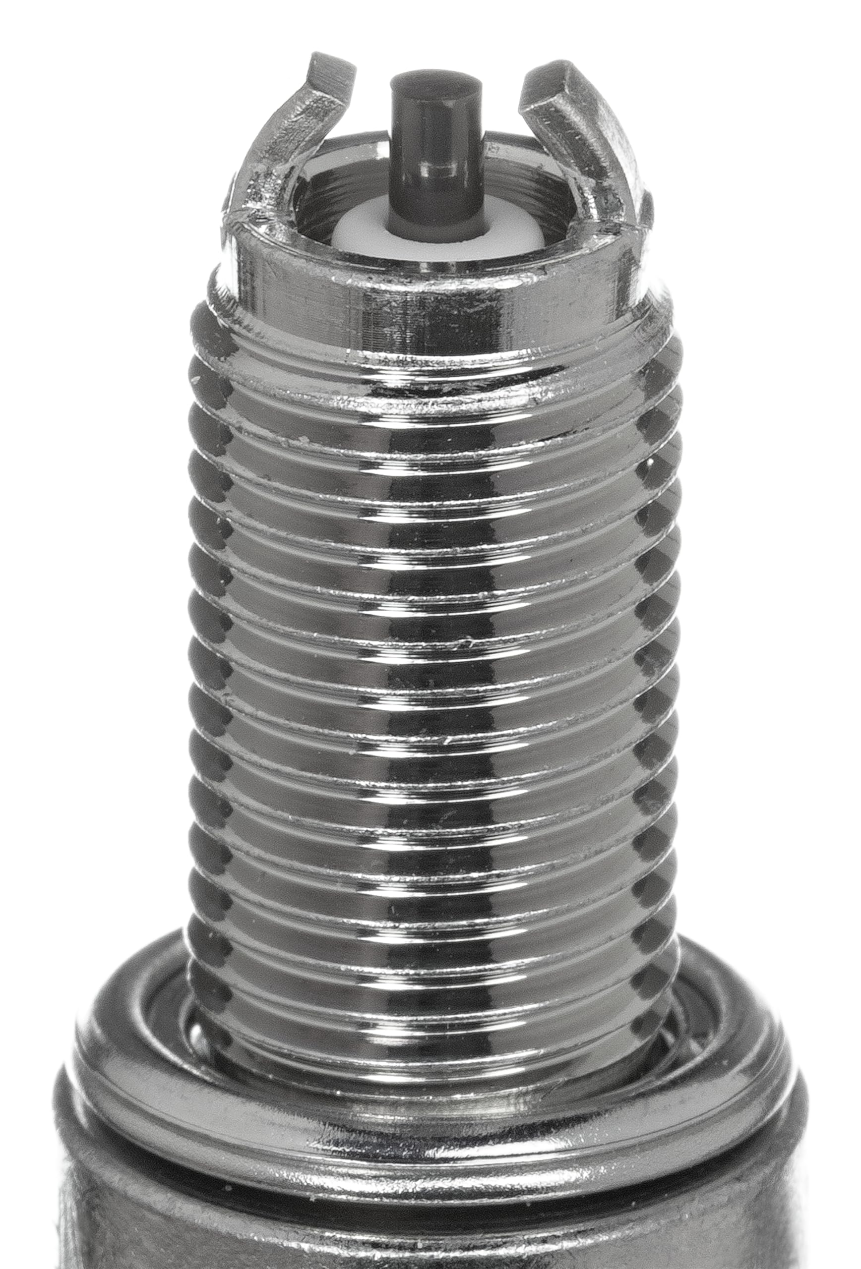 NGK CR9EK spark plug 4-pack closeup highlights resistance to carbon buildup for steady ignition.