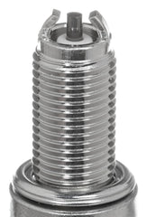 NGK CR9EK spark plug 4-pack closeup highlights resistance to carbon buildup for steady ignition.