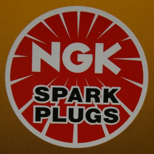 NGK DCPR7E spark plug 4-pack, front view, reliable ignition potential