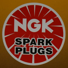 NGK DCPR7E spark plug 4-pack, front view, reliable ignition potential