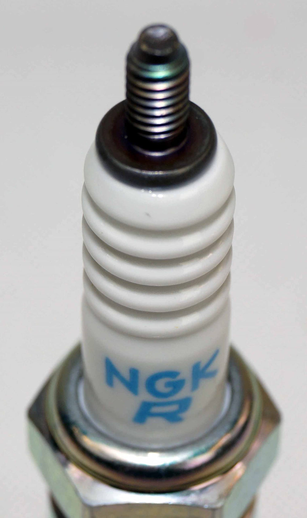 NGK direct replacement auto parts image emphasizes easy installation.